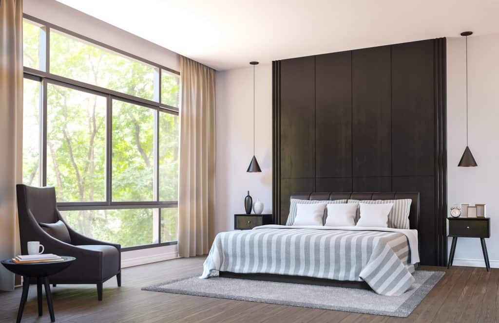 Modern bedroom decorate with brown leather furniture and black wood