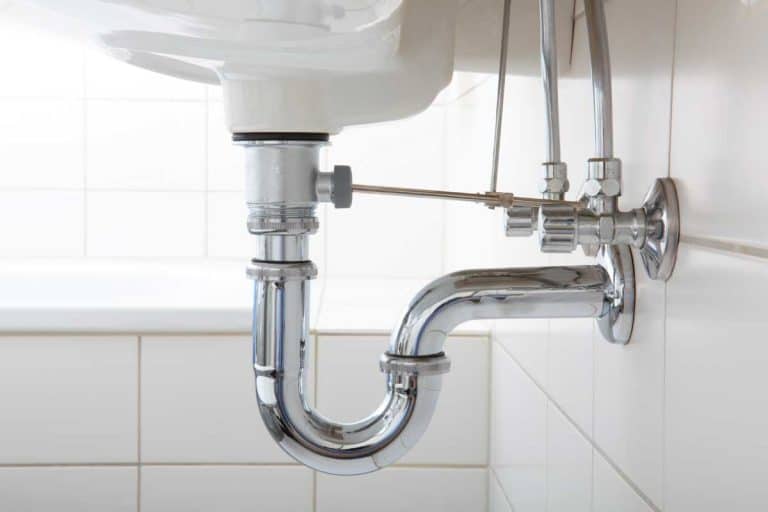 Sink pipe under wash basin in white bathroom, How To Hide Pipes Behind A Bathroom Sink [7 Great Methods]