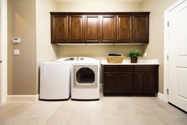 Spacious laundry room with washer and dryer in a modern American home. 15 Unique Laundry Room Cabinet Ideas