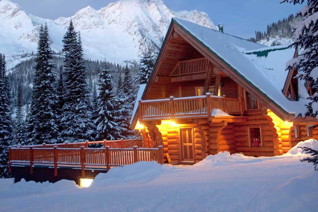 Winter scenic of a rustic, timber-framed lodge, 17 Amazing Exterior Log Cabin Ideas