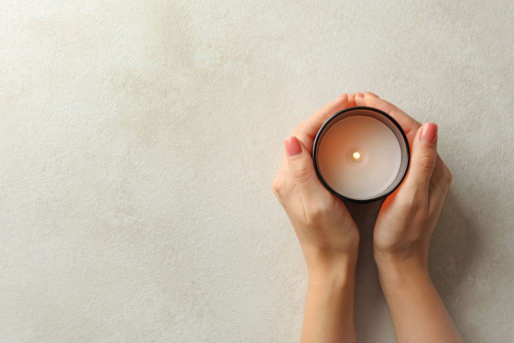 Woman holding a scented candle