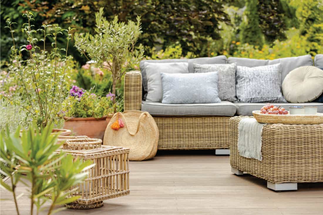 modern designed terrace with wicker furniture, seat cushion, throw pillows. How Long Does Outdoor Wicker Furniture Last