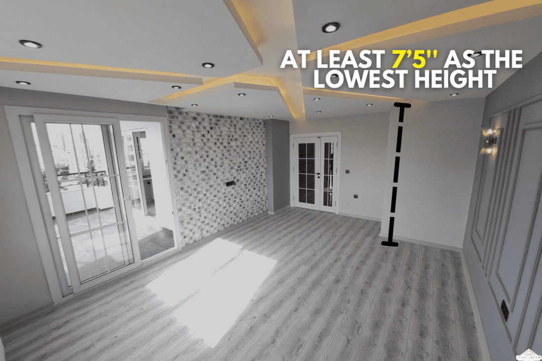 patterned suspended ceiling, spot lights, gray and stone patterned walls, a large living room. Finishing works, How Low Should A DropSuspended Ceiling Be