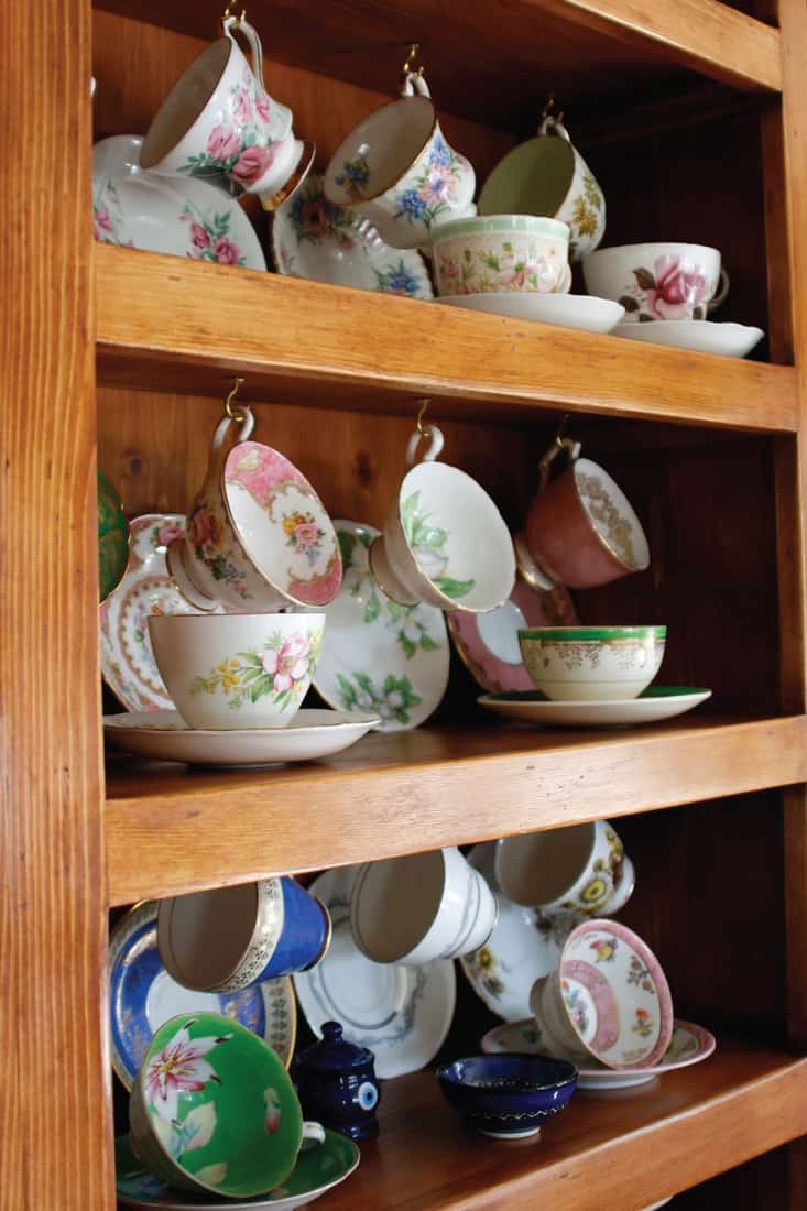 wooden China Cabinet full of Cups