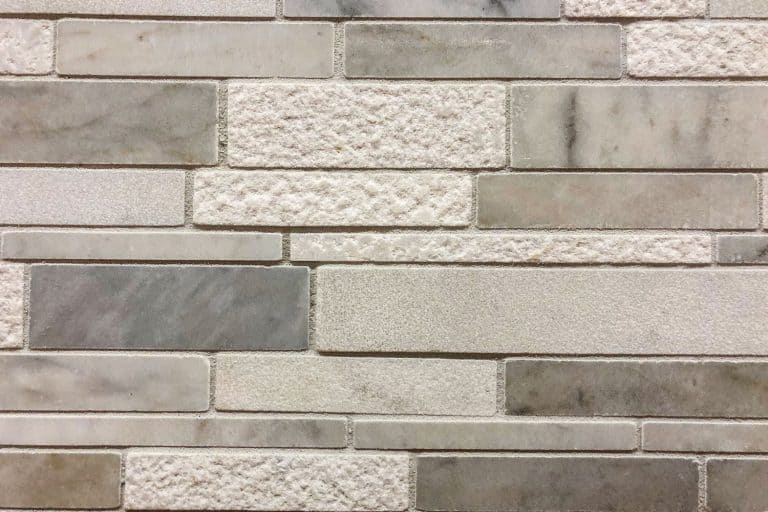 A detailed photo of a stone backsplash with realistic rock patterns, How To Clean Stone Backsplash In 4 Simple Steps
