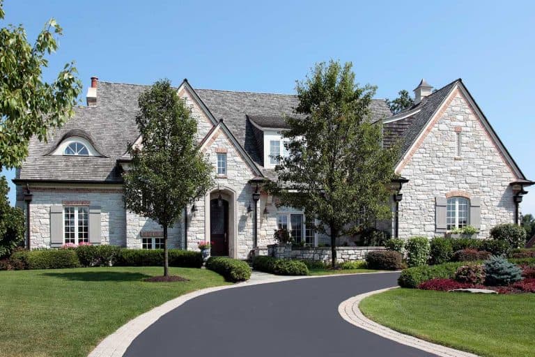A luxury stone home with circular driveway, How Long And Wide Is A Typical Driveway?