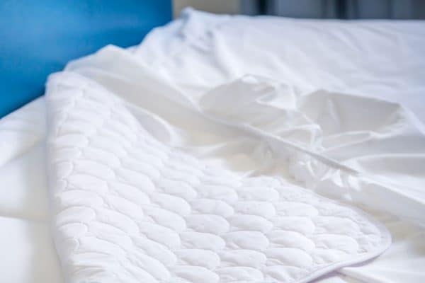 Read more about the article Should You Wash A Mattress Cover Before Using It?