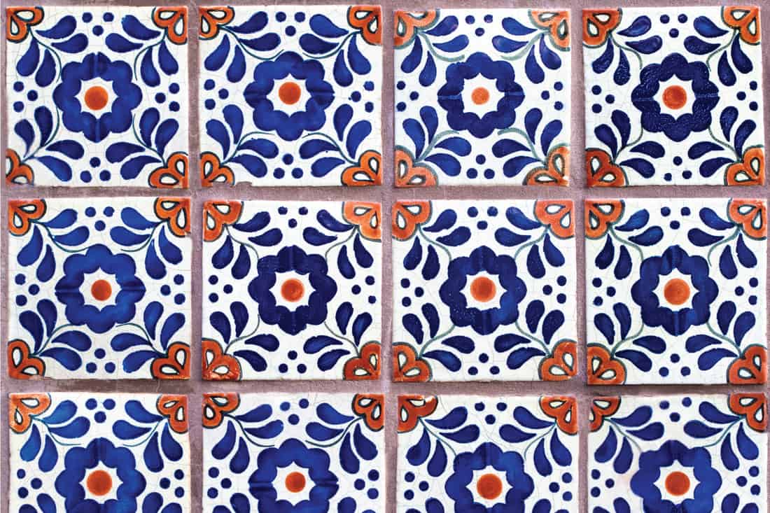 A wall of colorful geometric-floral Mexican (Talavera) tiles. Geometric Floral Mexican Tiles