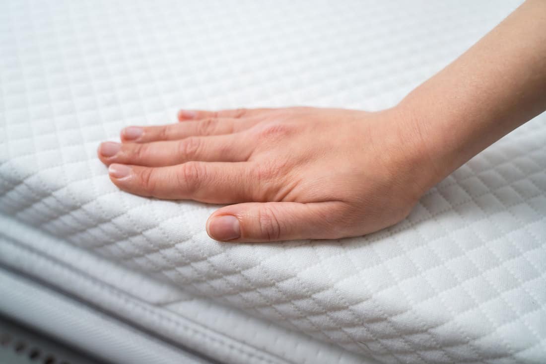 A woman putting mattress cover on the foam mattress, Can You Put A Mattress Cover On A Foam Mattress?
