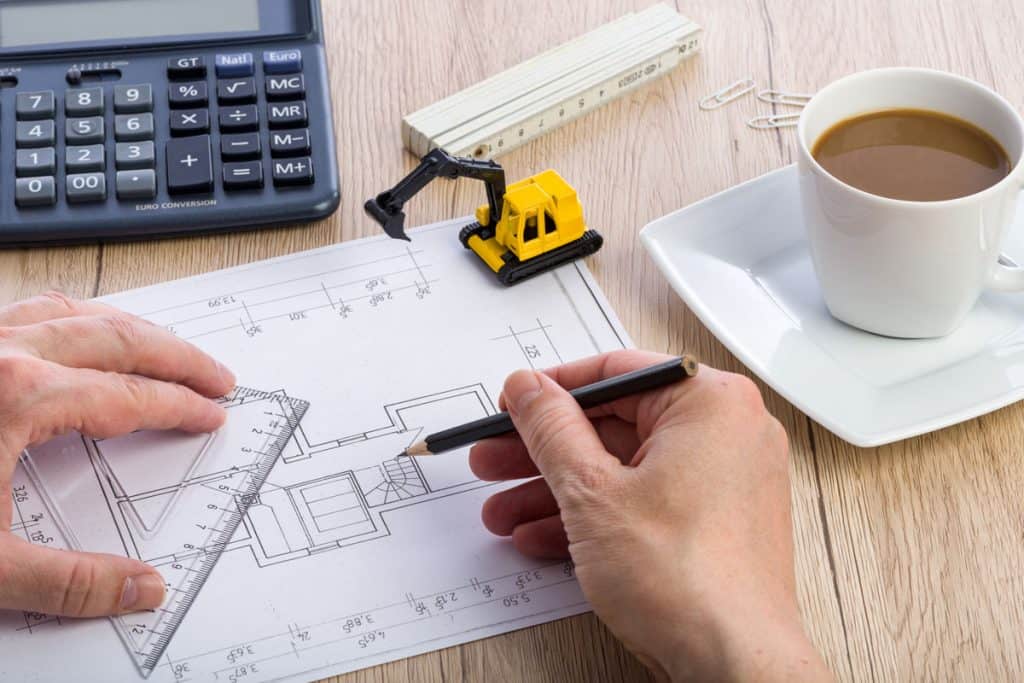 Architect working on a floor plan of a house
