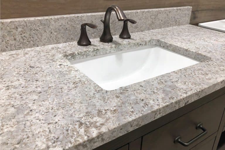 Bathroom vanity with granite counter and backsplash and white rectangular sink. 21 Backsplash Pattern Ideas To Inspire You