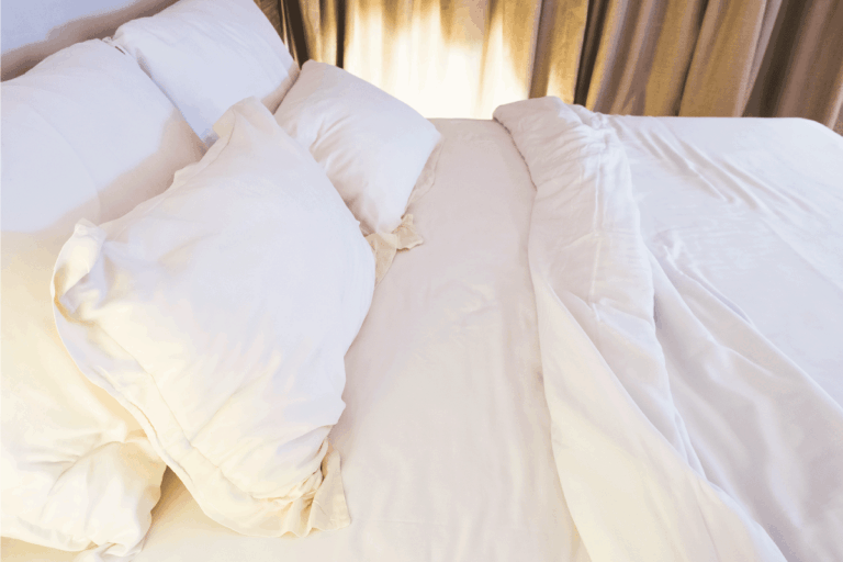 Bed mattress and pillow messed up in bedroom. How To Fold A Mattress Cover In 4 Easy Steps