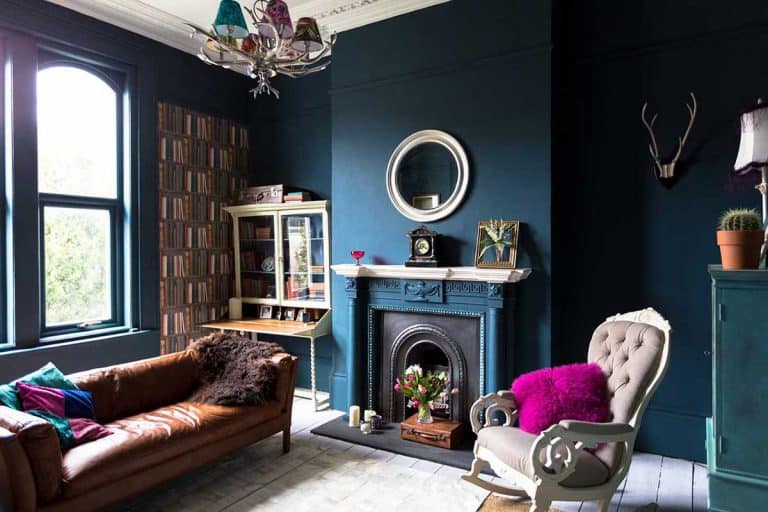 Blue living room with high ceiling, blue wall and vintage decors, 27 Navy And Dark Blue Living Room Ideas