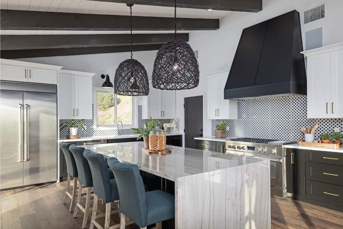 Color photo of a beautiful modern kitchen. close spade design backsplash