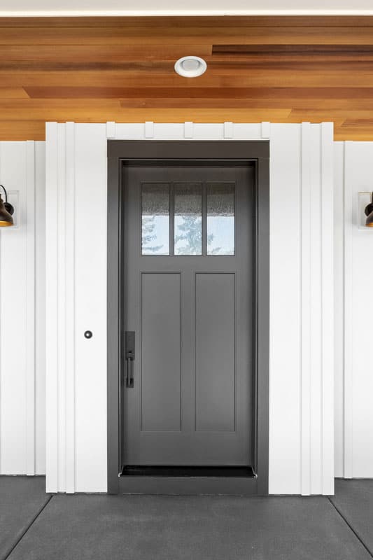 Gray door with a gray wooden door jamb