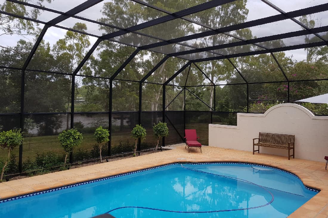 Home swimming pool with enclosure
