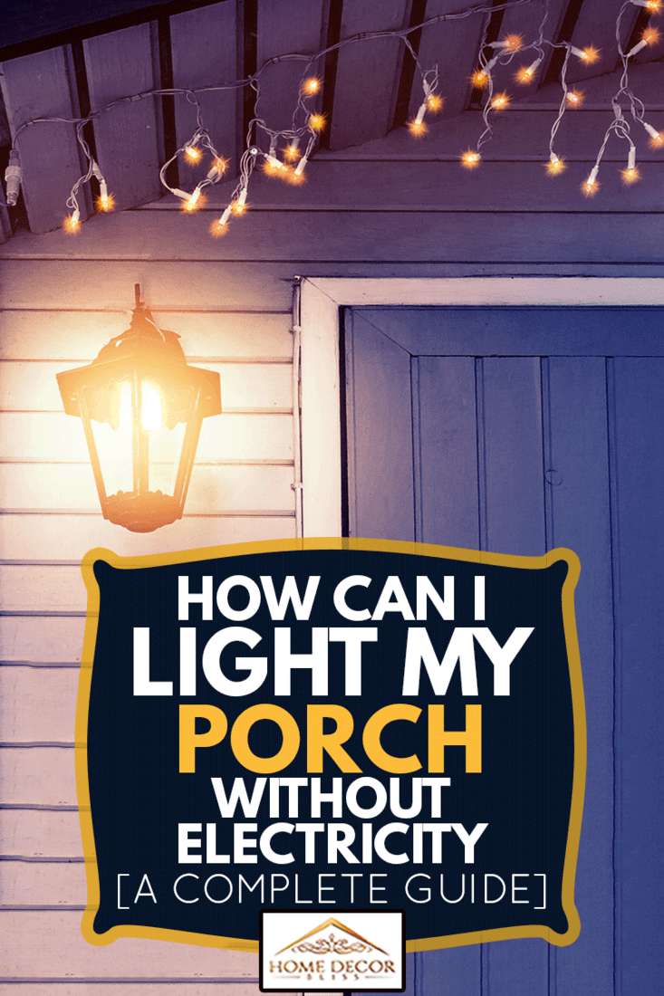 Porch of the house is decorated in the traditional Scandinavian style with a lantern and Christmas lights , How Can I Light My Porch Without Electricity? [A Complete Guide]