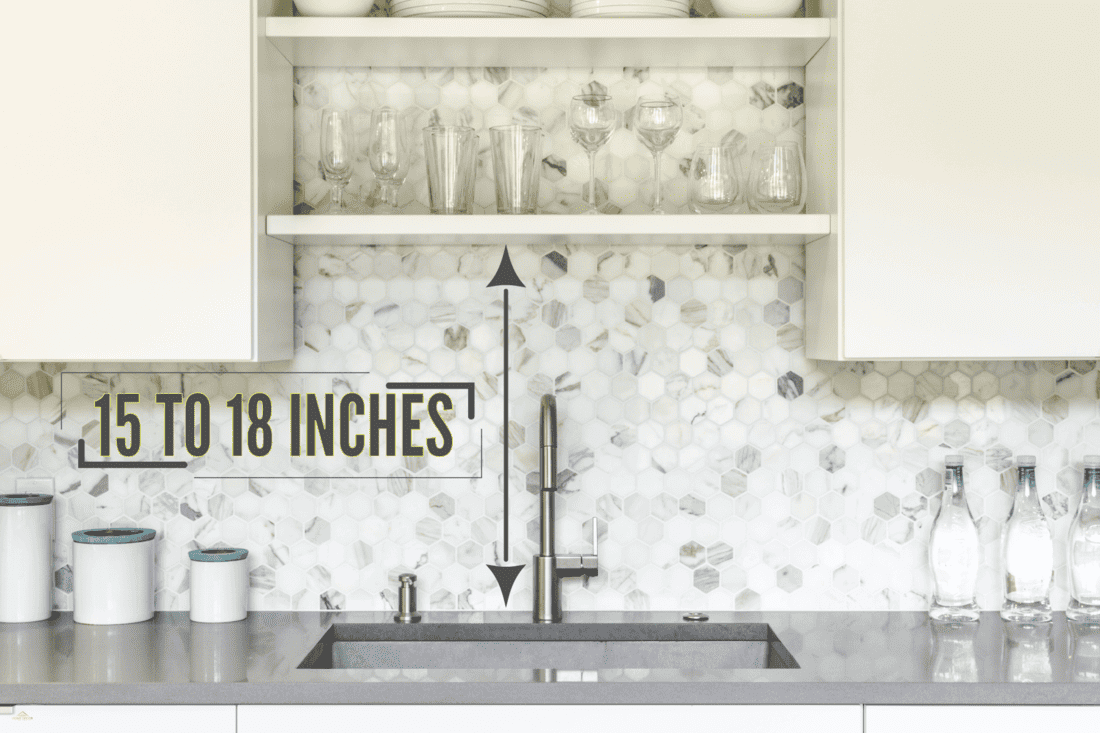 Gorgeous white hexagonal tile backsplash and gray countertop, How High Do You Tile A Kitchen Backsplash?