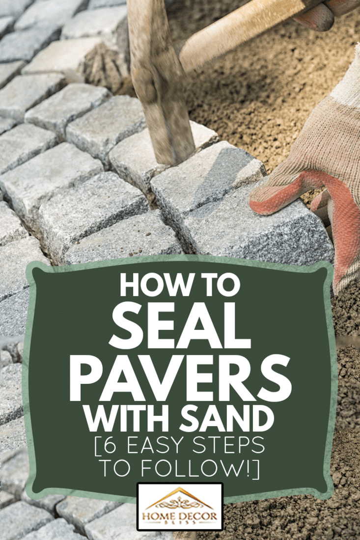 Laying paving stone, just hands in gloves and a hammer in action, hammering on the paving stones, How To Seal Pavers With Sand [6 Easy Steps To Follow!]