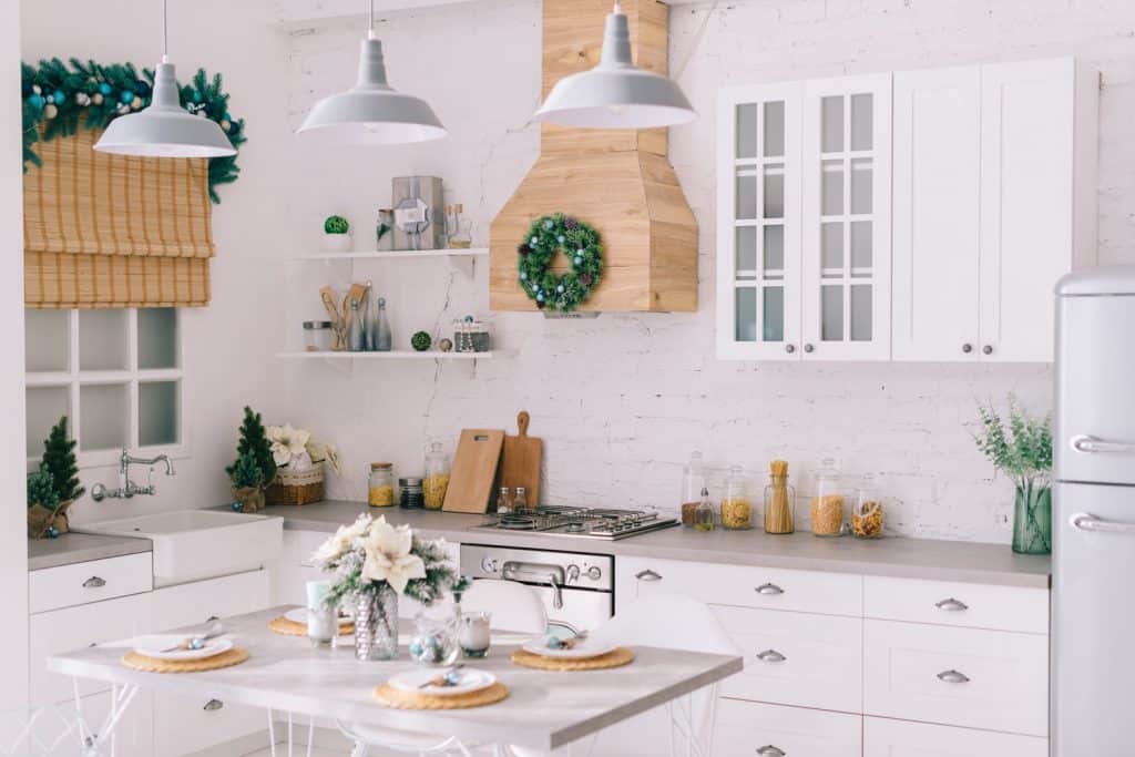 Interior of a bright modern kitchen in vintage style, decorated with Christmas decor, general plan