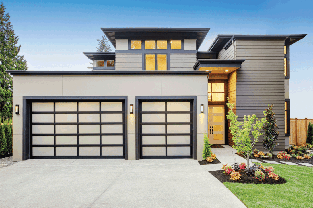 Luxurious new construction home with two garage doors. 15 Exterior Garage Ideas To Help Inspire You