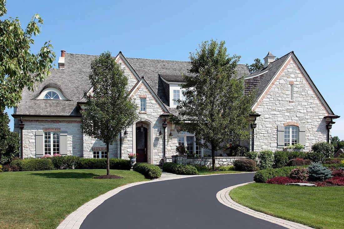 Luxury stone home with circular driveway