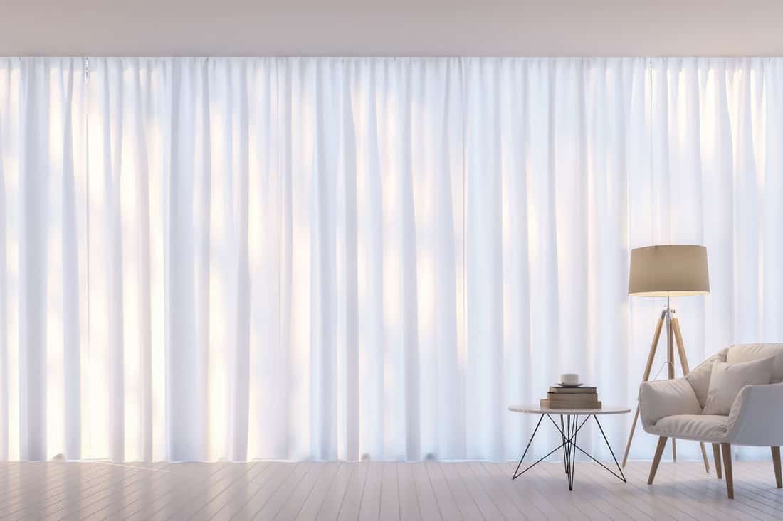 Modern white living room minimal style.There are decorate room with white translucent curtain and white armchair, Will Sheer Curtains Keep Mosquitoes Out?