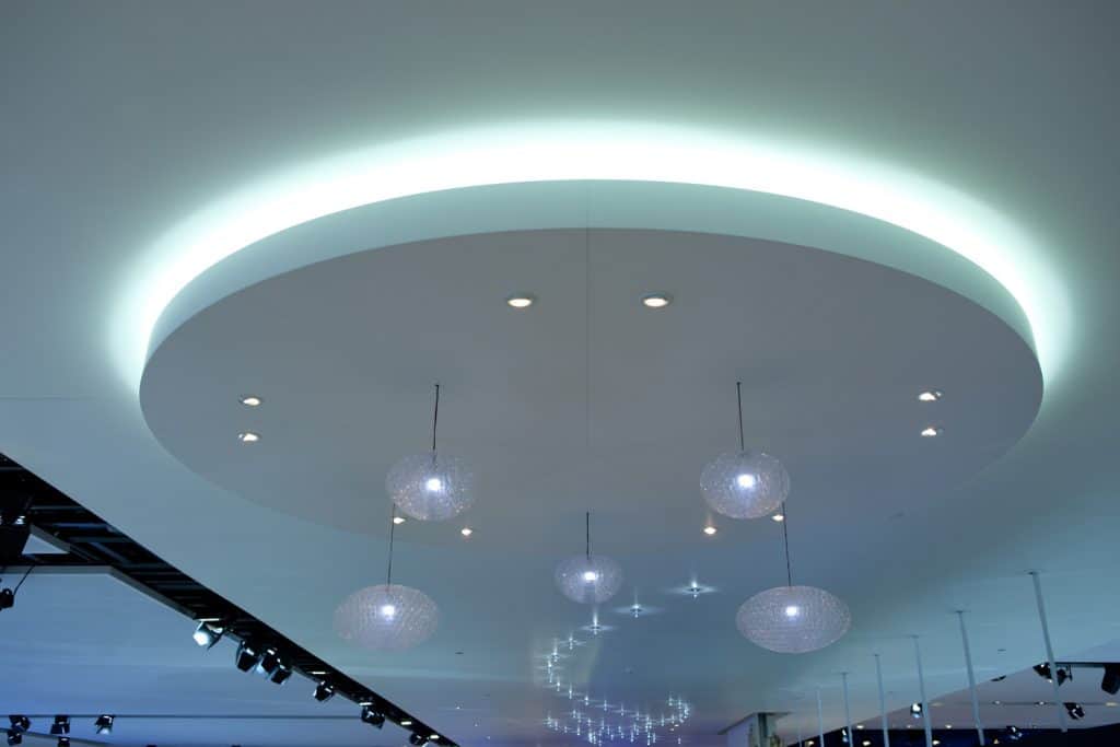 Multiple chandeliers integrated into the ceiling