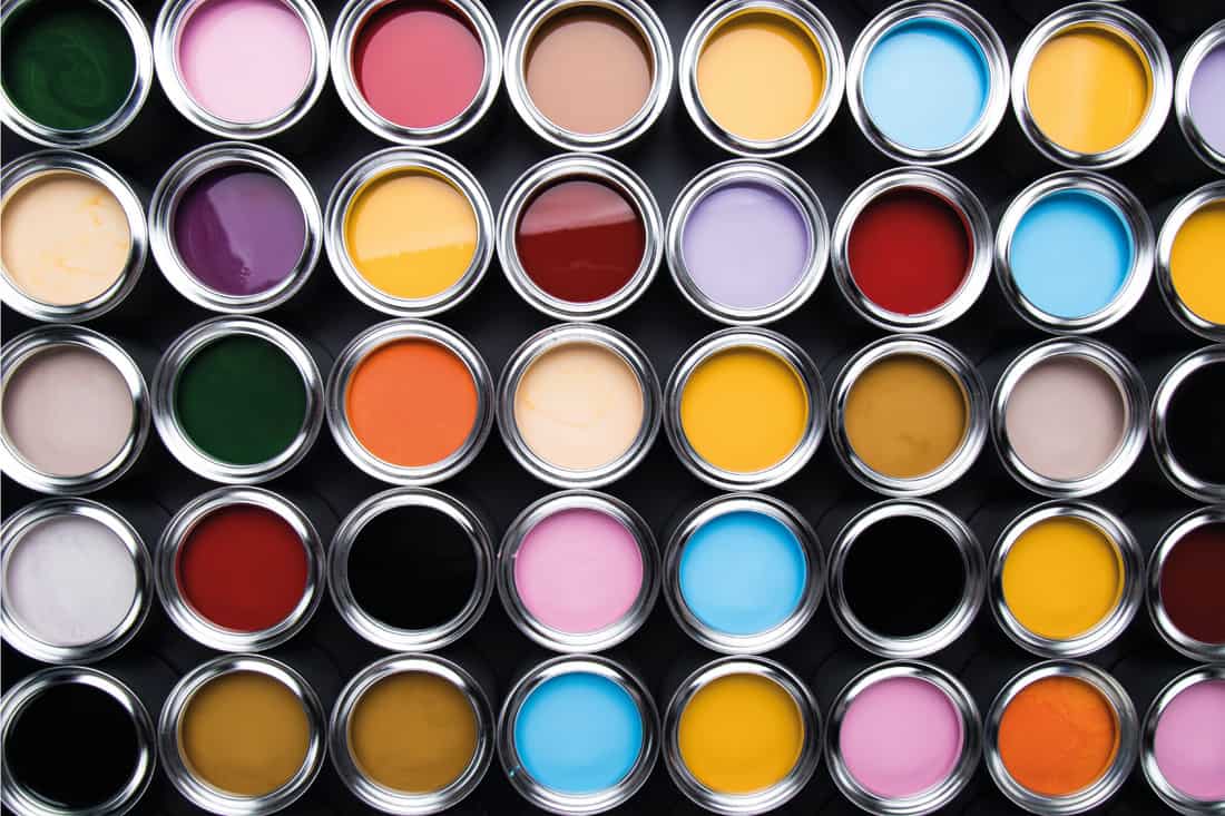 Open cans of paint of different colors. overhead photo