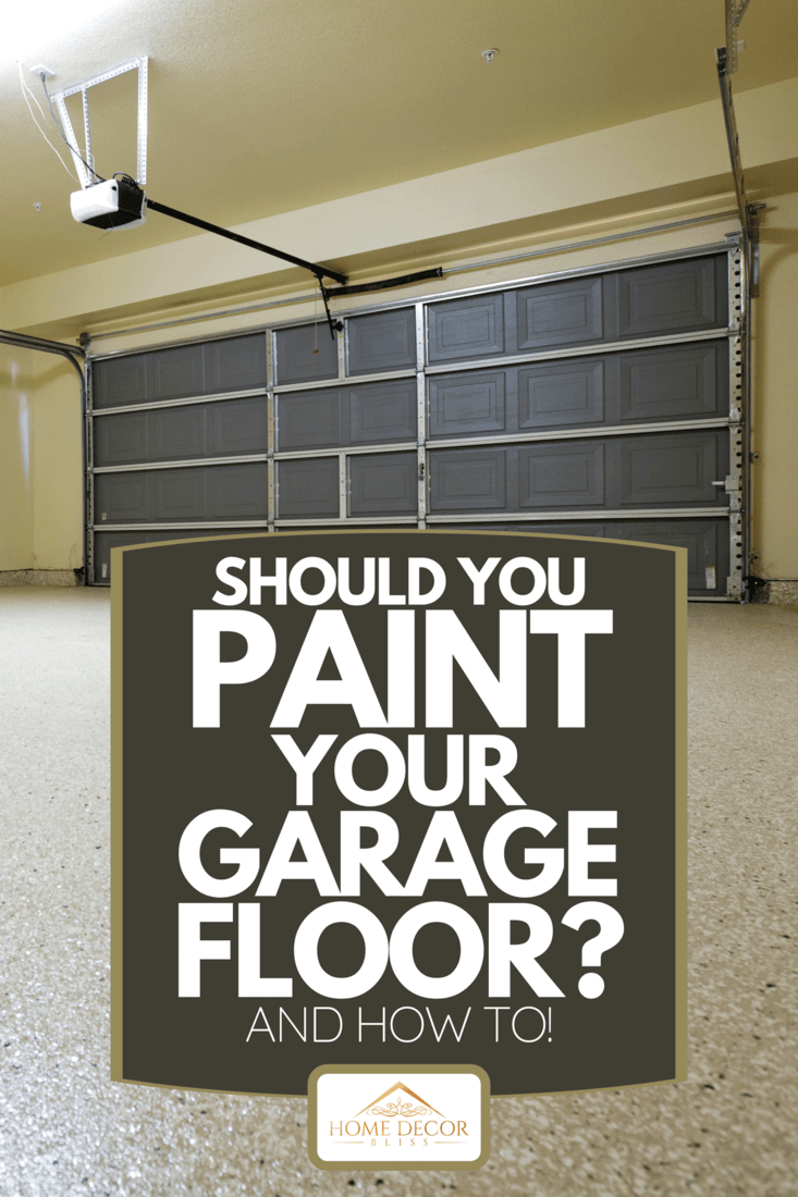 An empty garage with beige walls, Should You Paint Your Garage Floor? [And How To!]