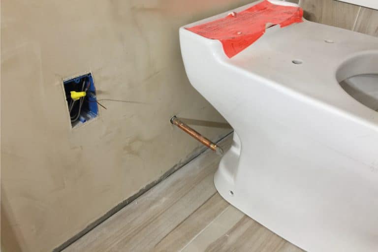 Toilet-installation-details-during-remodeling-bathroom-with-electric-and-plumbing-work, Do Toilets Wear Out? And How Long Do They Last?