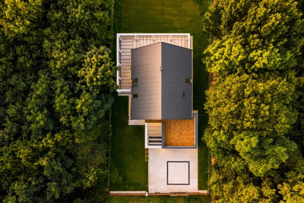 Top view of a contemporary house with dense trees on the sides, Does A Garage Count As Square Footage?