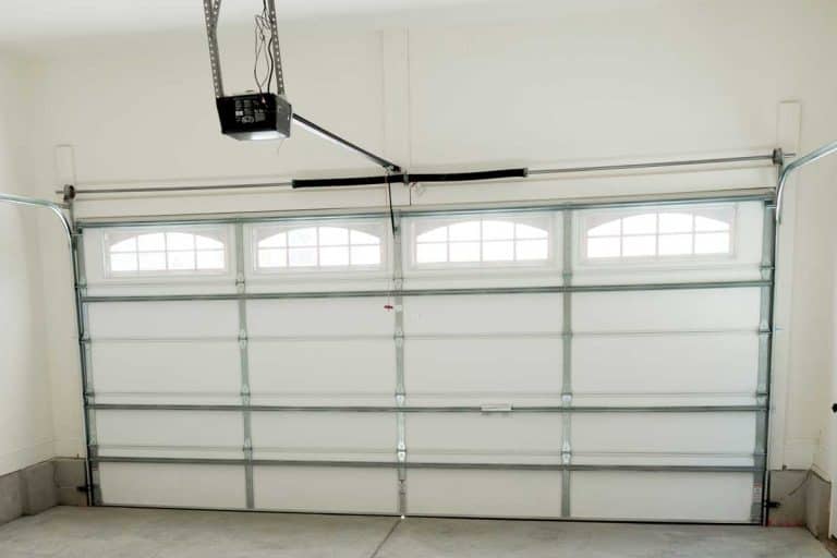 Two car garage interior with garage door opener, How Much Does A Liftmaster Garage Door Opener Cost?