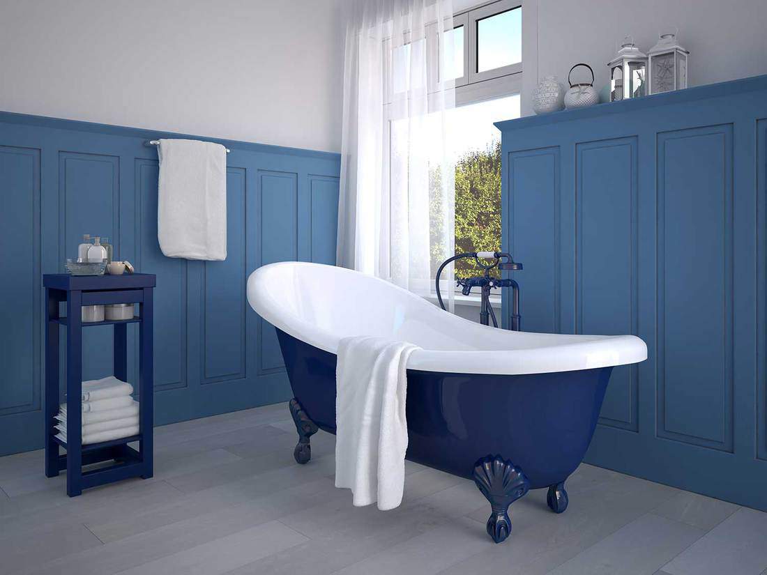 Salle de bain couleur bleu vintage avec baignoire