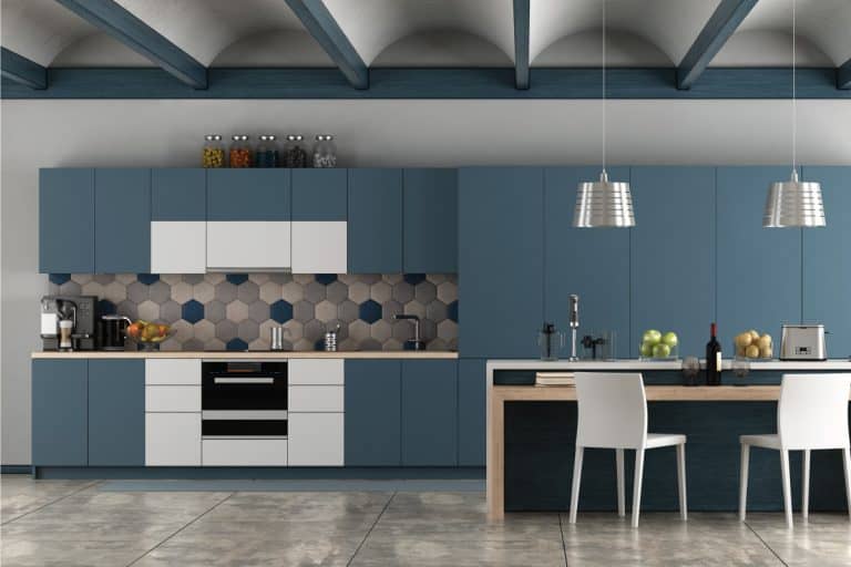 White and blue contemporary kitchen with arched ceiling and cement floor. blue gray and white contrasting backsplash. Should A Backsplash Match The Wall Color
