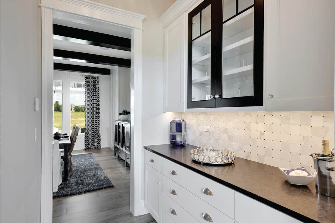 White cabinets and black accents give modern look to this new build