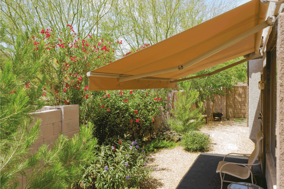 backyard with automatic retractable awning for extra shade