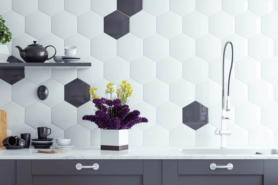 modern kitchen interior background with black and white contrasting tiles