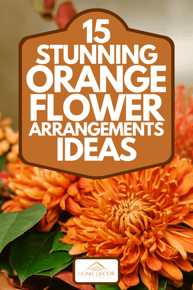 Pumpkin with beautiful and bright autumn flowers inside, standing on the brown wooden window sill, 15 Stunning Orange Flower Arrangement Ideas