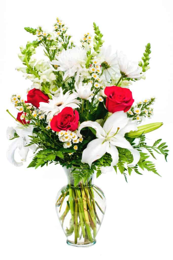 A beautiful mixture of white lilies and red roses