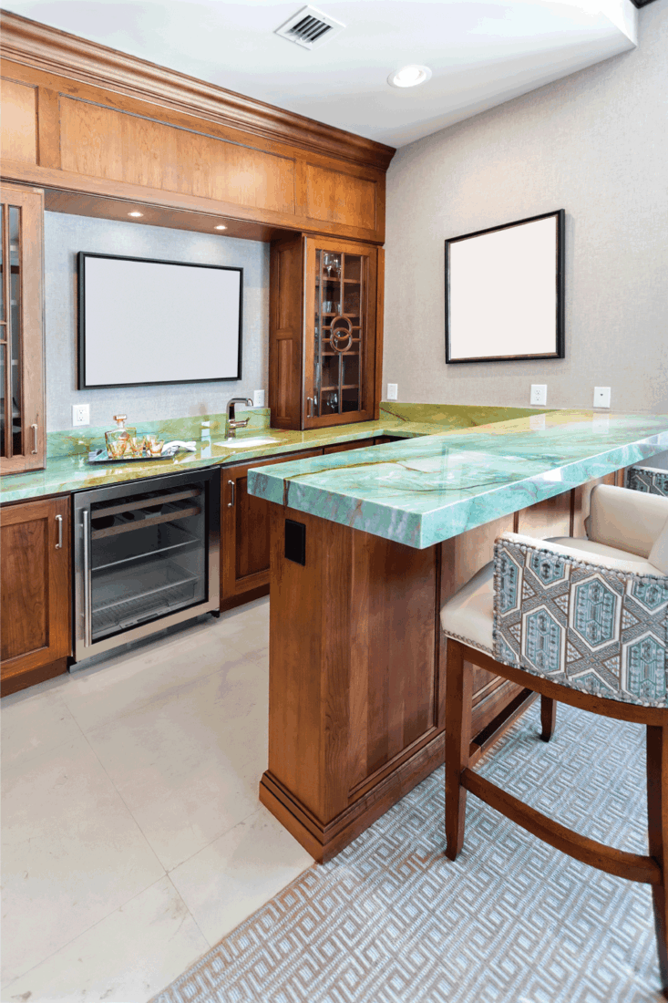 Bar area in a large home with bright green colored countertop