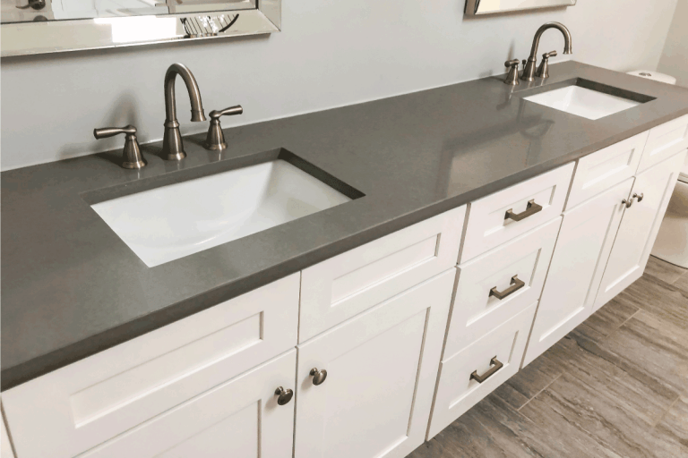 Bathroom vanity white cabinets with quartz countertop and white rectangular sinks and chrome faucets. How Much Do New Bathroom Cabinets Cost