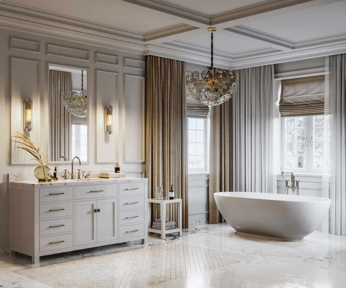 Bathtub and furniture in a bathroom of a luxurious seaside house