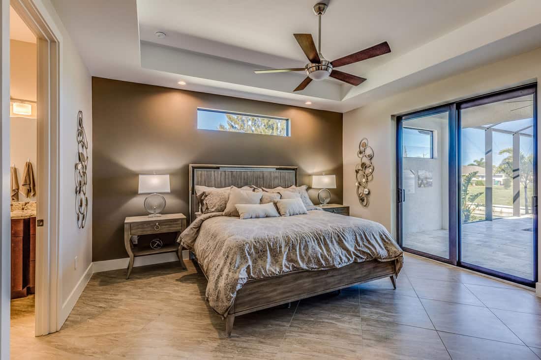 Ceiling fan and awning linear window above the bed, Should You Have Ceiling Fan In Your Bedroom?