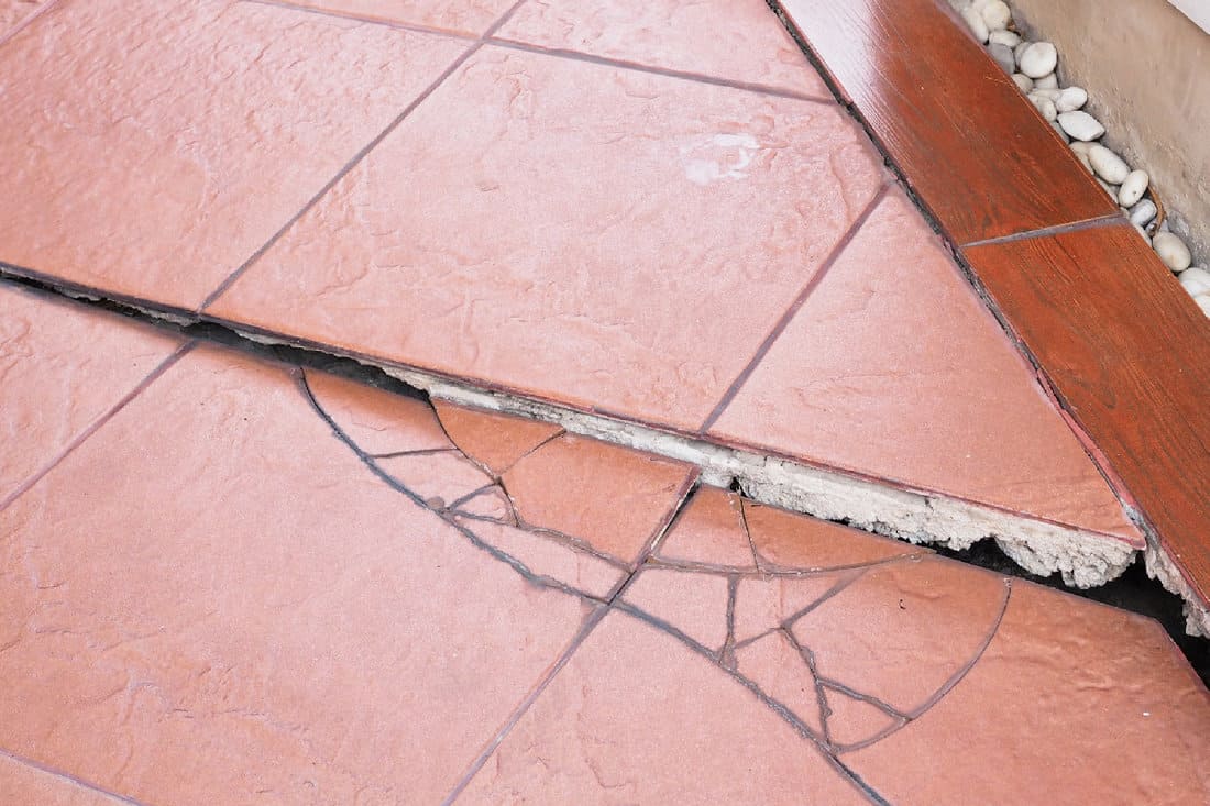 Collapsed house structure problems with cracked floor tiles
