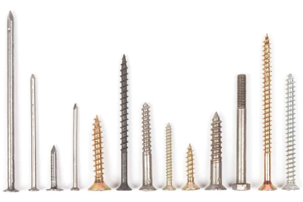 Different sizes and specification of bolts on a white background
