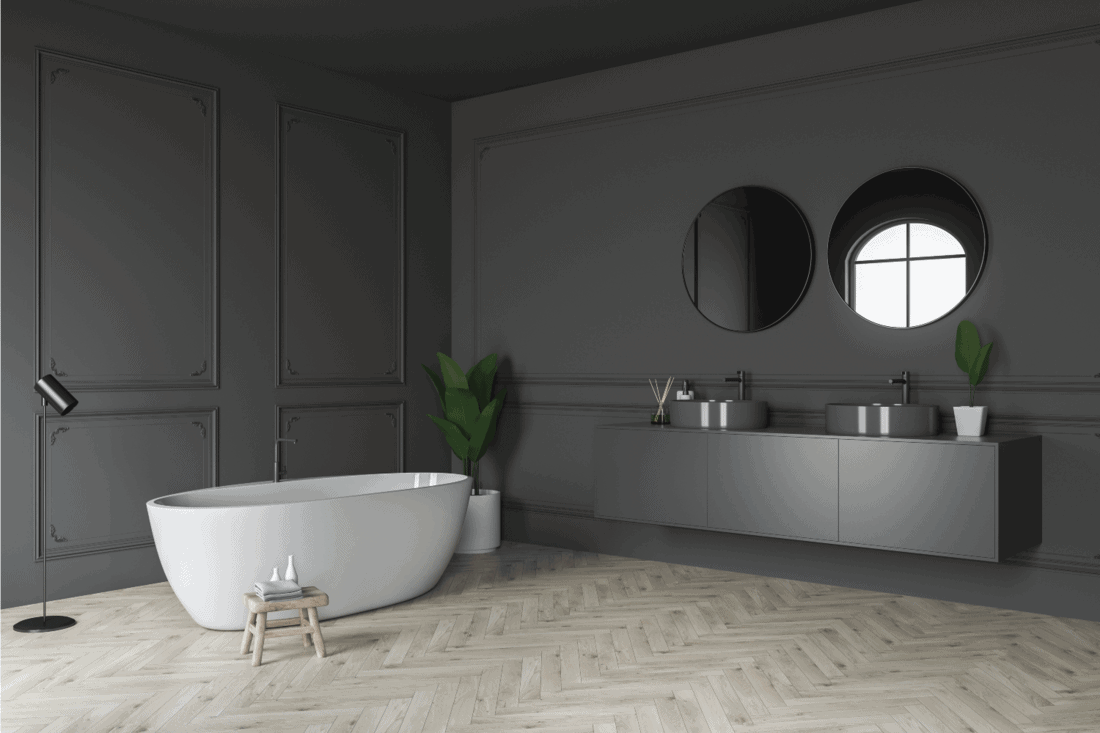 Gray bathroom corner, tub and sink