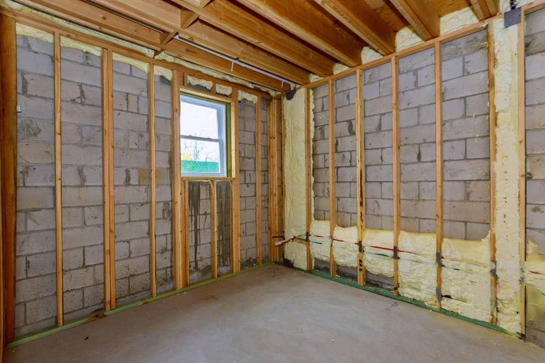 House in unfinished under construction in insulation foam the wall of a basement