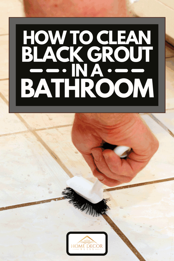 A person cleaning grout with brush, How To Clean Black Grout In A Bathroom
