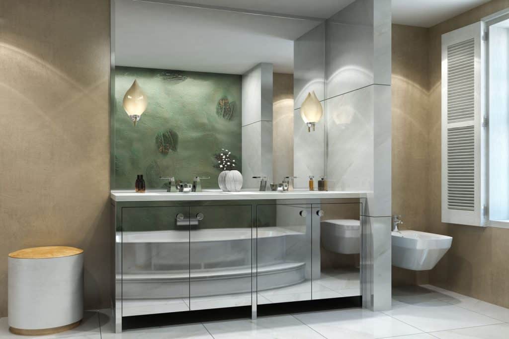 Interior of a gorgeous contemporary inspired bathroom with brown walls, metal cabinets, and a huge square mirror